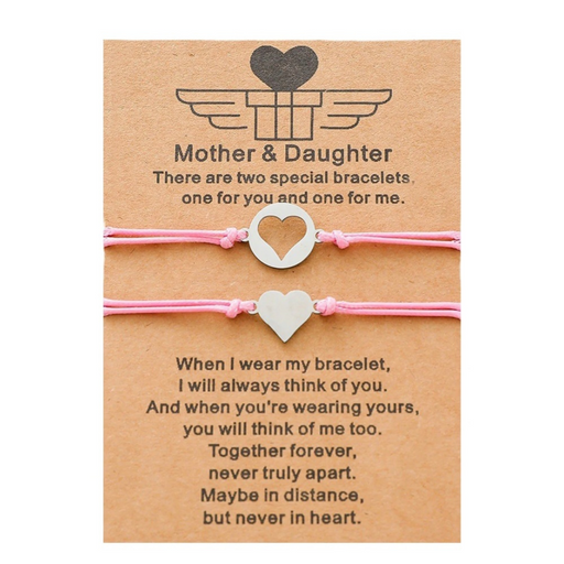 2 pink heart string bracelets with a message card