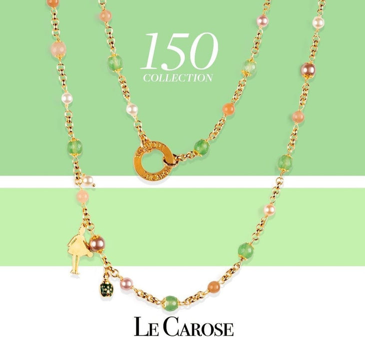 le carose gold plated necklace on green and white background