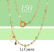 le carose gold plated necklace on green and white background