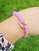 girl wearing purple bead bracelet