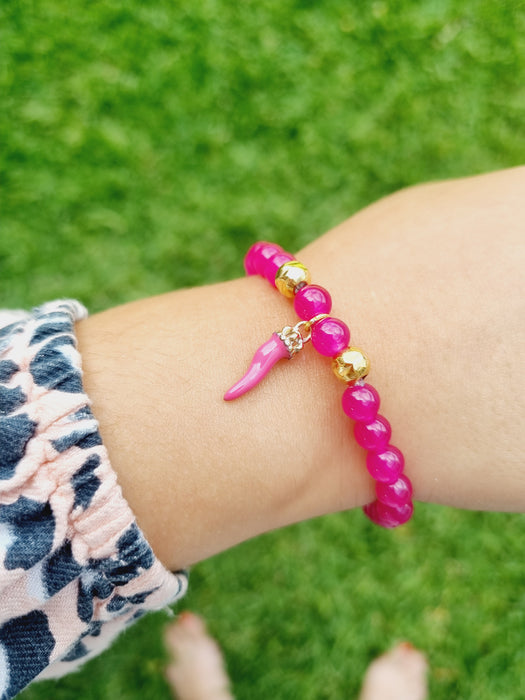 girl wearing pink bead bracelet