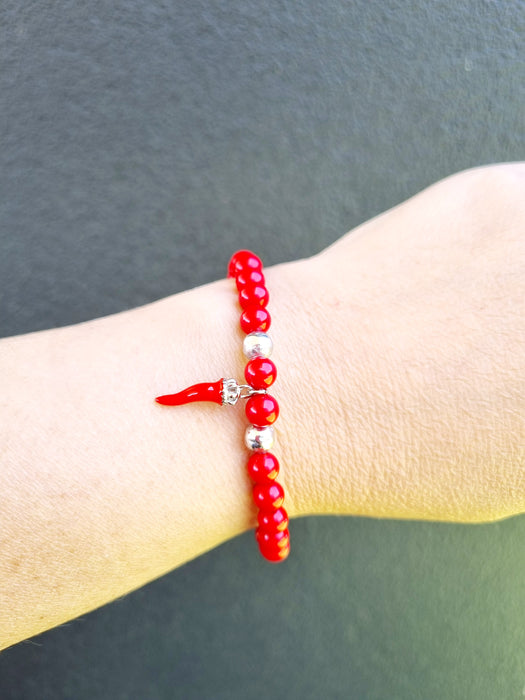 red bead bracelet with corno horn charm