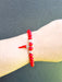 red bead bracelet with corno horn charm