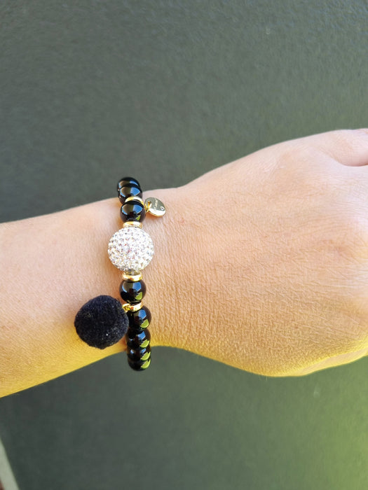 lady wearing black bead bracelet 