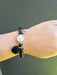 lady wearing black bead bracelet 