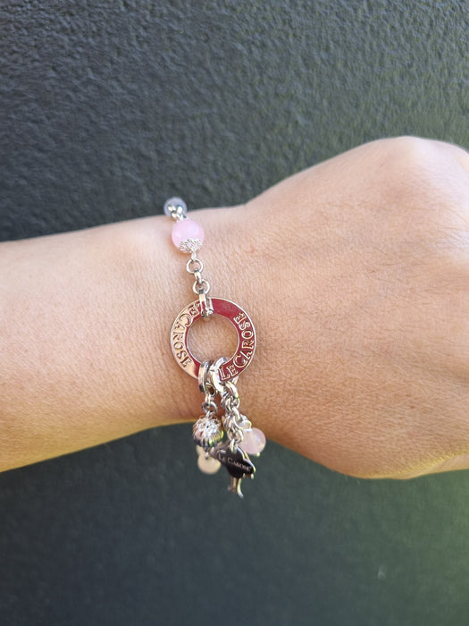 girl wearing silver bracelet with charms