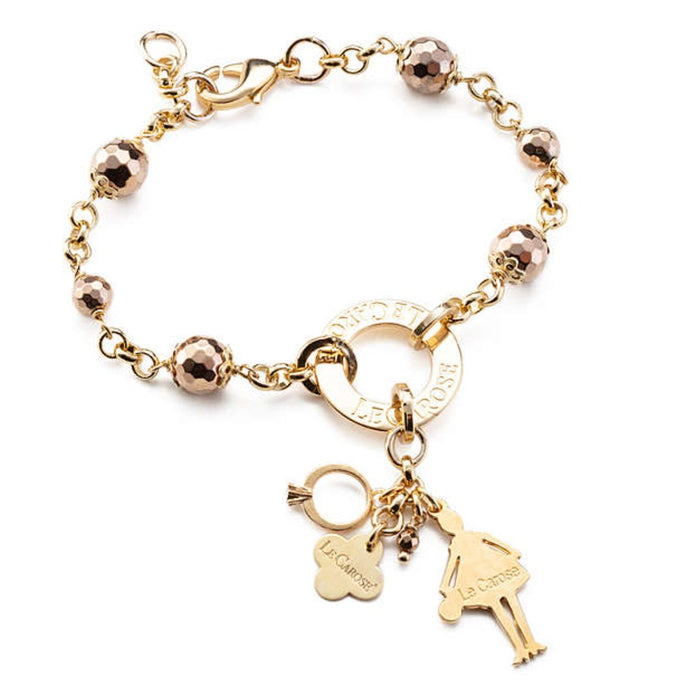 gold plated ladies charm bracelet with rose gold spheres and charms.