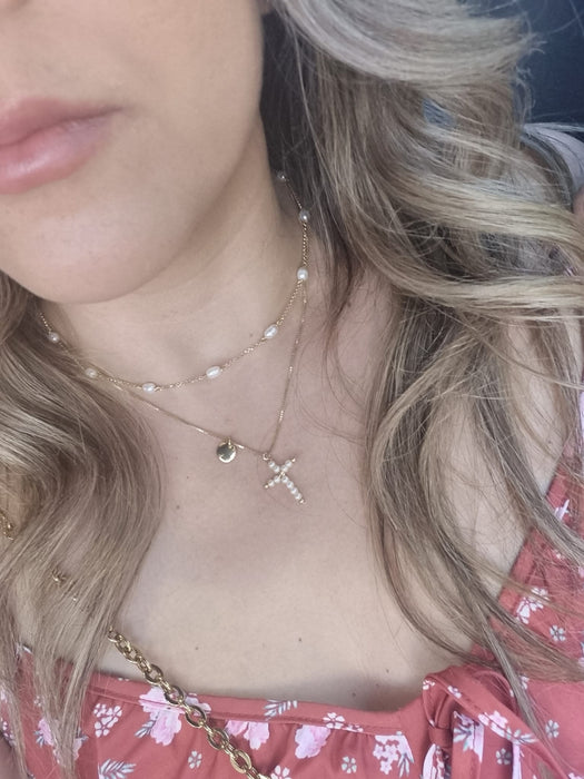 Girl with blonde hair wearing Gold plated 2 chain necklace with pearl cross