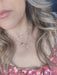 Girl with blonde hair wearing Gold plated 2 chain necklace with pearl cross